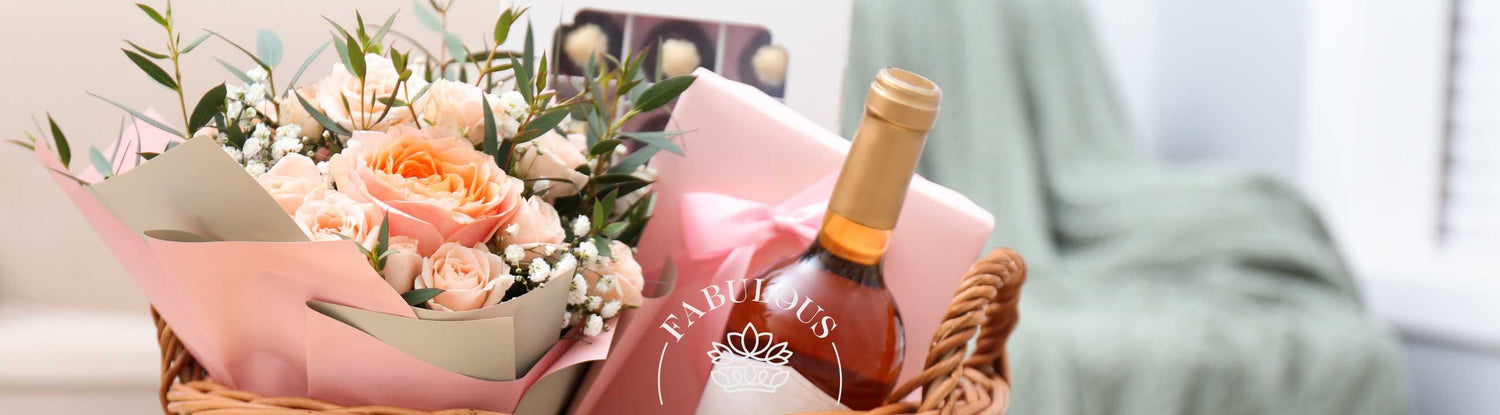 Beautiful gift basket with roses, a bottle of wine, and chocolates, perfect for special occasions with Fabulous Flowers and Gifts.