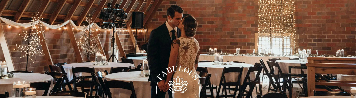 Bride and groom sharing a kiss in a beautifully decorated venue 