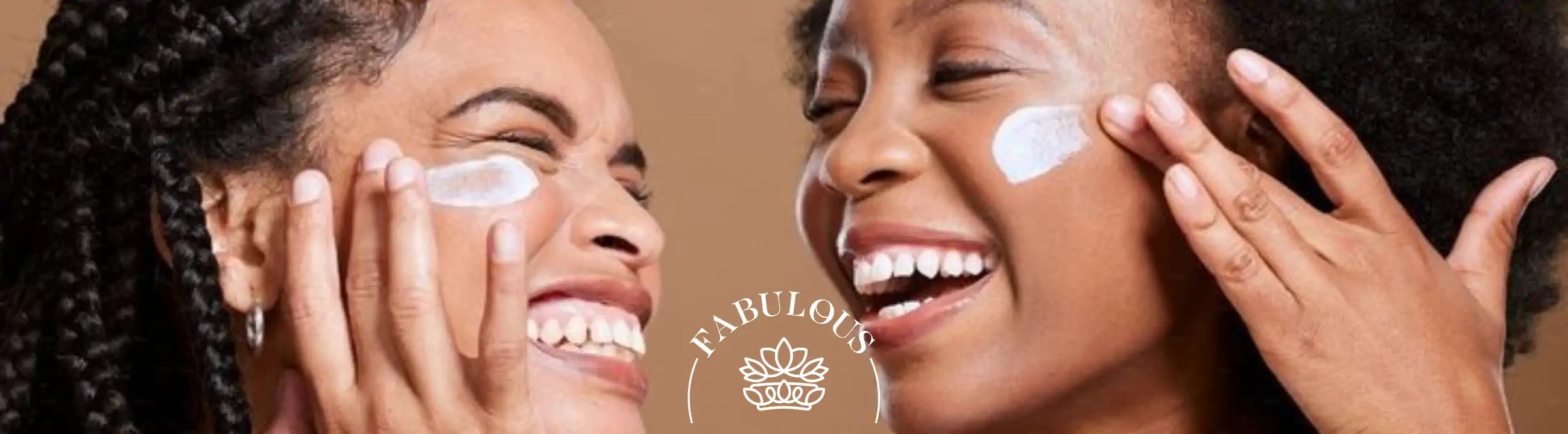Two joyful women applying skincare cream to their faces - Fabulous Flowers & Gifts.