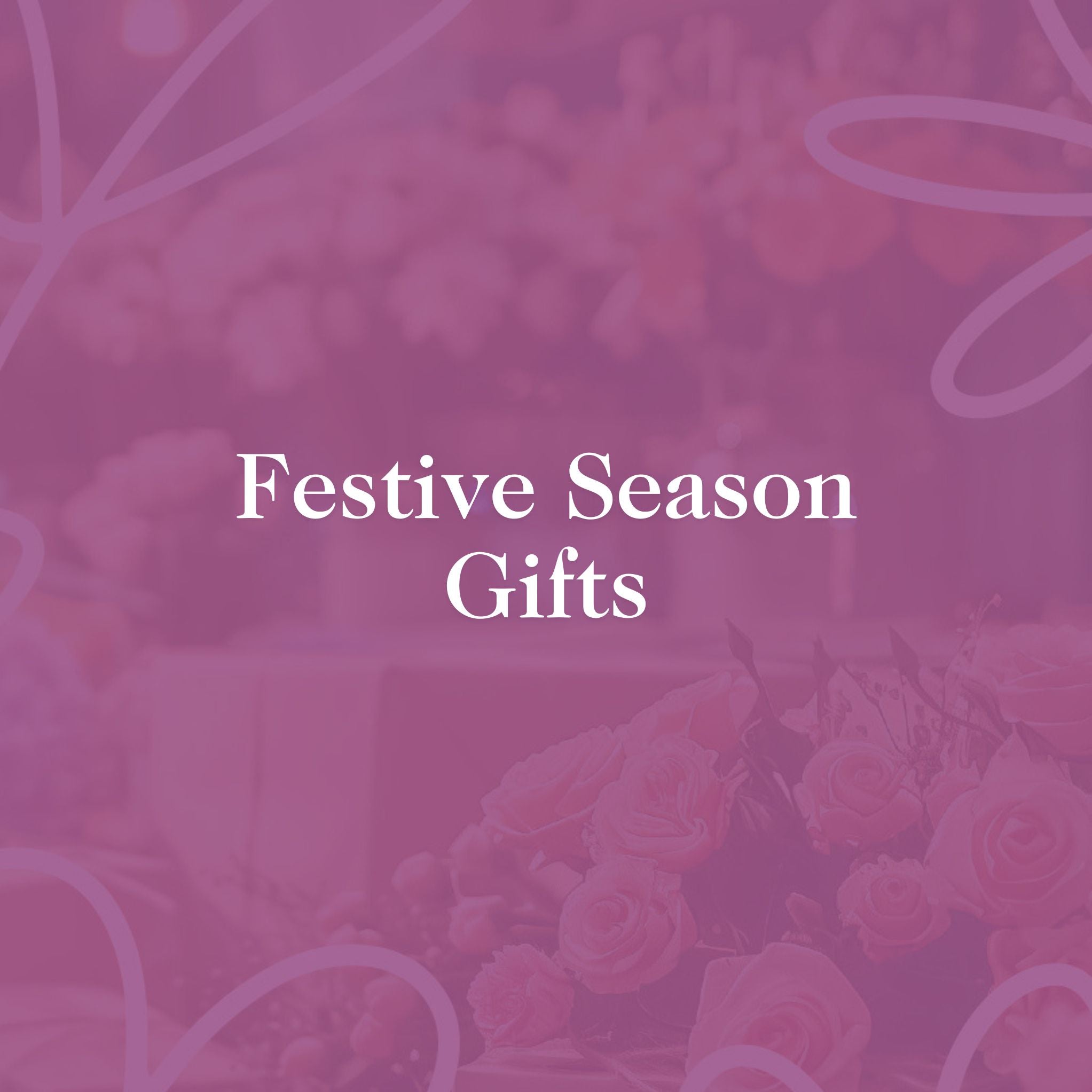 Festive Season Gifts - Elegant pink background with roses, highlighting seasonal gift inspiration from Fabulous Flowers and Gifts.