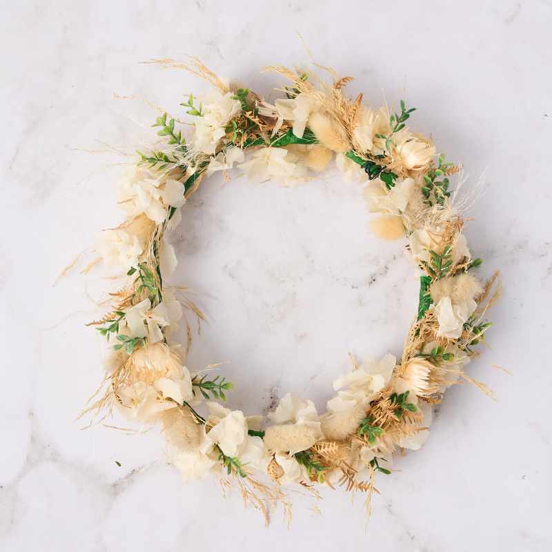 Delicate dried floral wreath with neutral tones, perfect for a natural, rustic look. Fabulous Flowers and Gifts