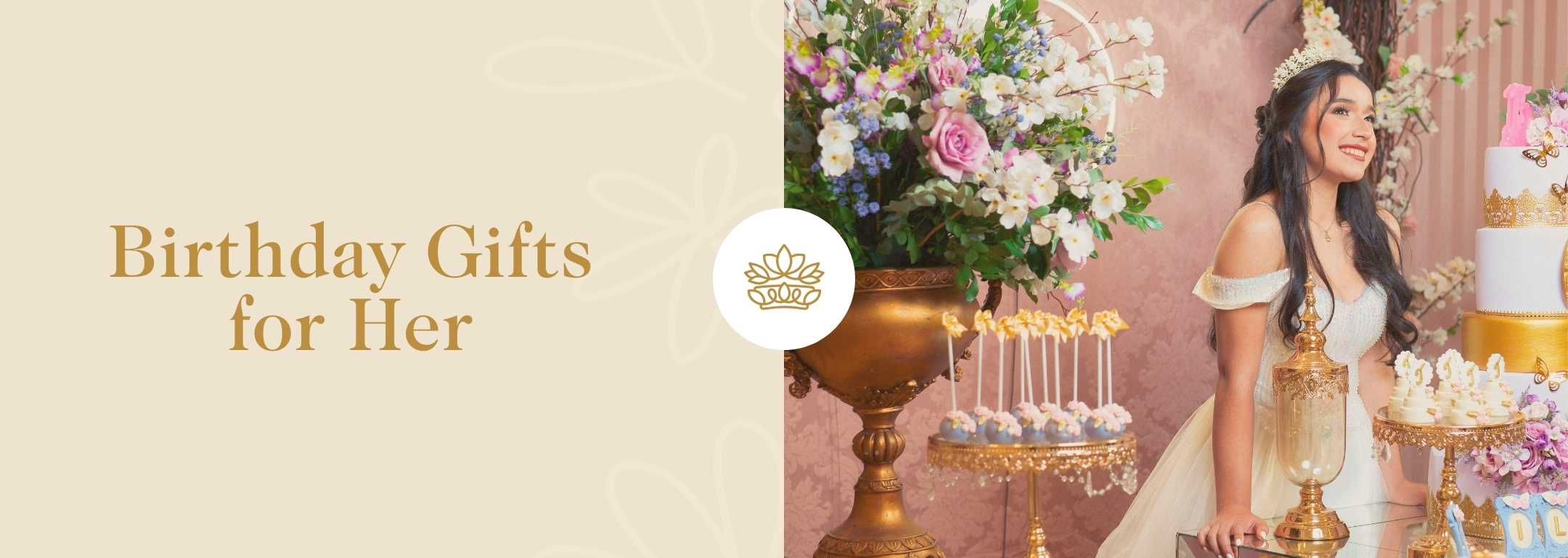 An elegant birthday setting featuring a woman smiling beside a table adorned with a lavish floral arrangement and a tiered birthday cake, embodying the charm of luxurious birthday gifts for her.