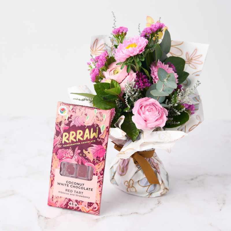 Blossom Beauty Posy flower arrangement with RRRRAW handcrafted chocolate, featuring pink roses, eucalyptus, and vibrant blooms in a delicate wrap.