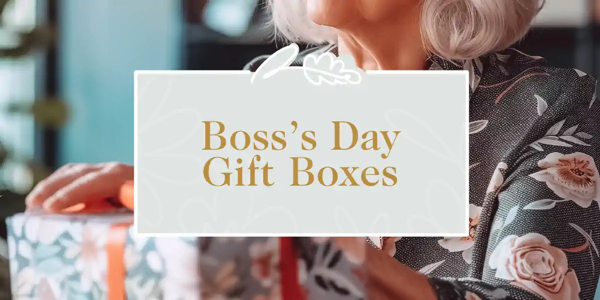 A person with gray hair holding beautifully wrapped gift boxes adorned with floral patterns, perfect for celebrating Boss's Day. Boss's Day Gift Boxes Collection. Fabulous Flowers and Gifts.