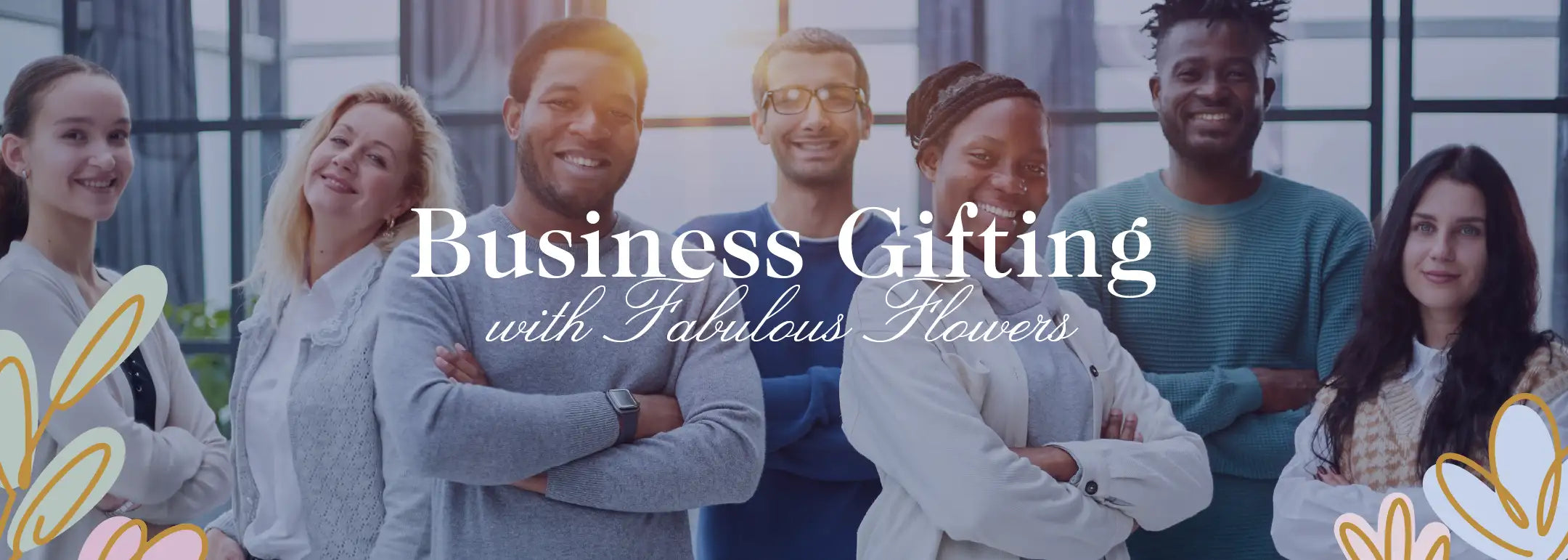 Diverse group of smiling professionals standing confidently with arms crossed in a modern office setting. Business Gifting with Fabulous Flowers. Fabulous Flowers and Gifts. Business Gifting.