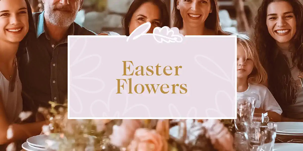 A family celebrating Easter around a table adorned with a beautiful flower arrangement. Fabulous Flowers and Gifts - Easter Flowers