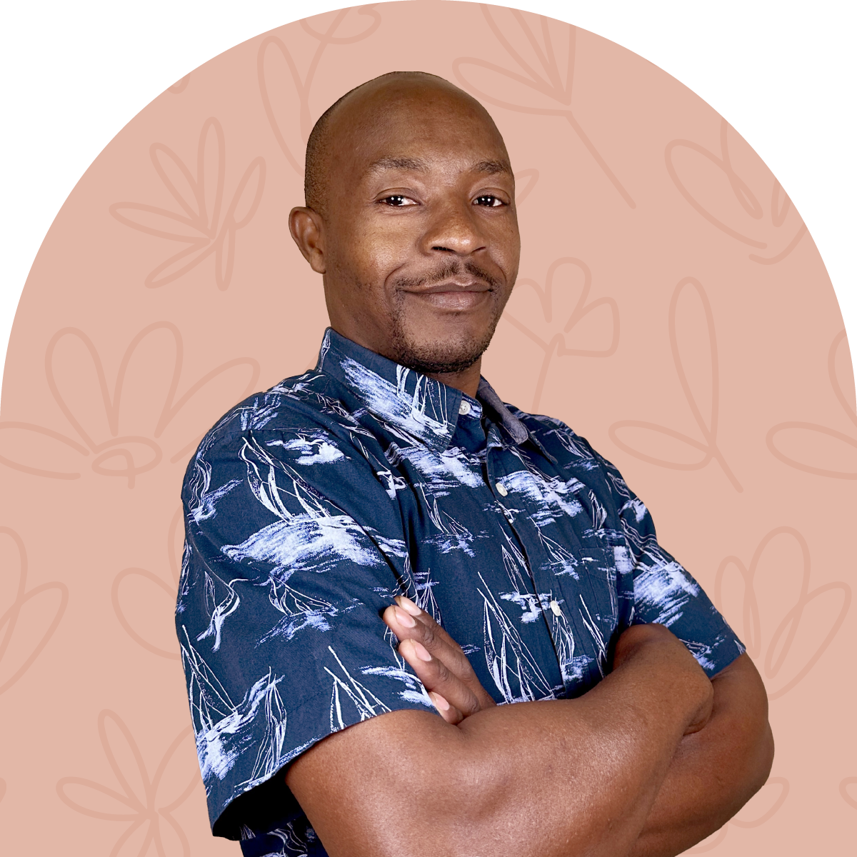 Portrait of Elias, a team member at Fabulous Flowers, wearing a navy patterned shirt against a beige background. MEET THE TEAM at Fabulous Flowers and Gifts.