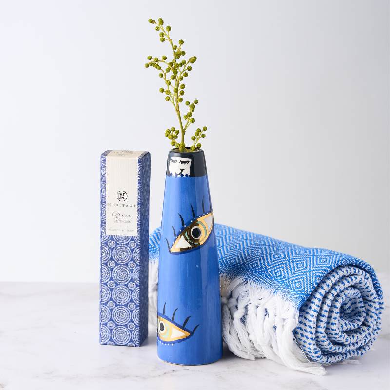 Eyeland Holiday Gift set with a blue vase featuring eye design, luxurious Turkish towel, and room spray. Ideal for a stylish holiday vibe.