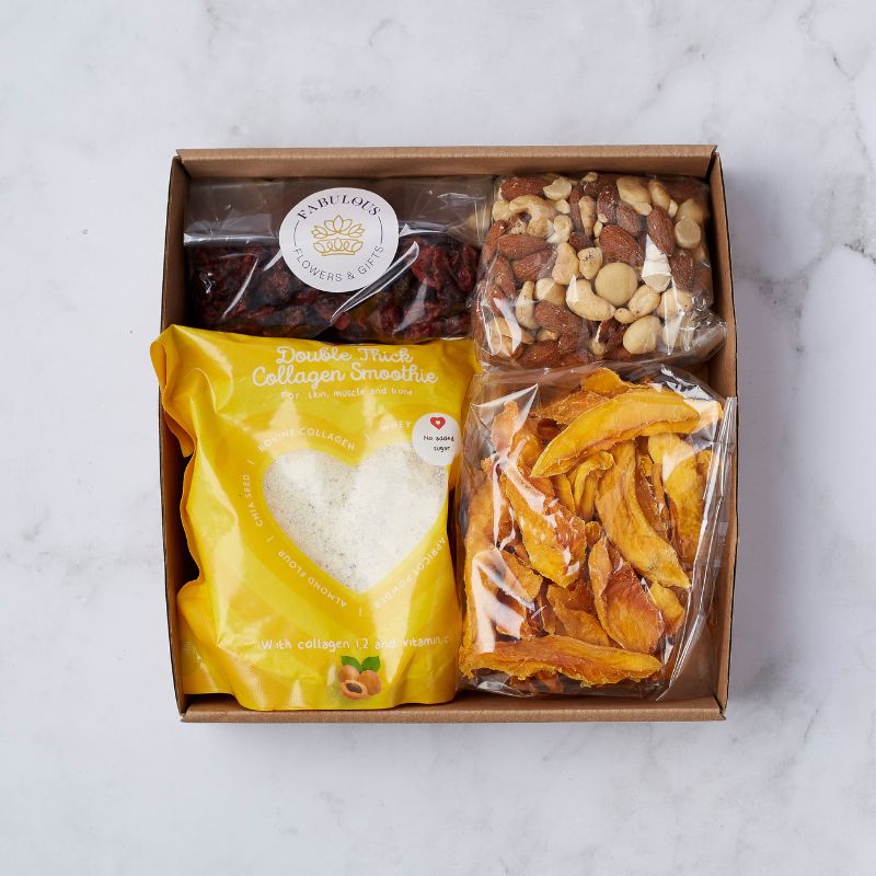 Fabulous Wellness Delight Gift Box featuring collagen smoothie mix, dried mango slices, mixed nuts, and cranberries.