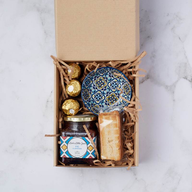 Fig and Lavender Delight Gift Box featuring a decorative blue bowl, fig and lavender jam, and Ferrero Rocher chocolates.