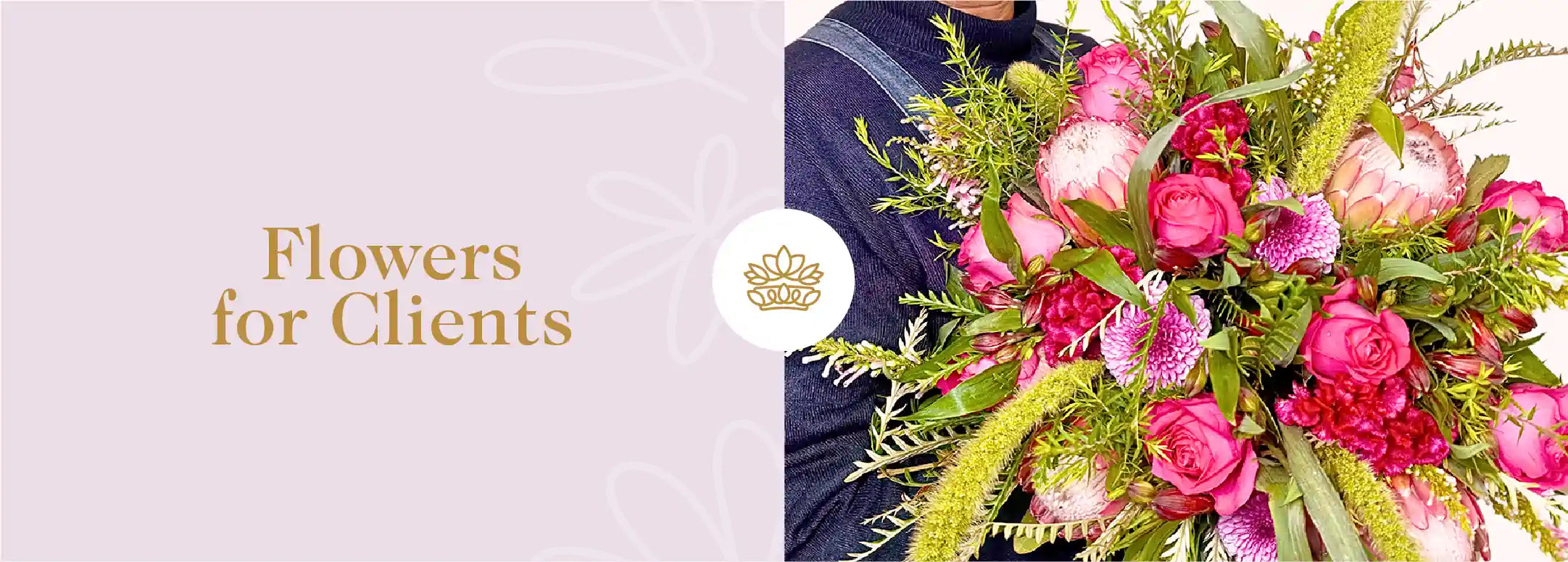 A person presenting a lush bouquet of mixed pink and red flowers, ideal for making a lasting impression on clients. Fabulous Flowers and Gifts - Flowers for Clients