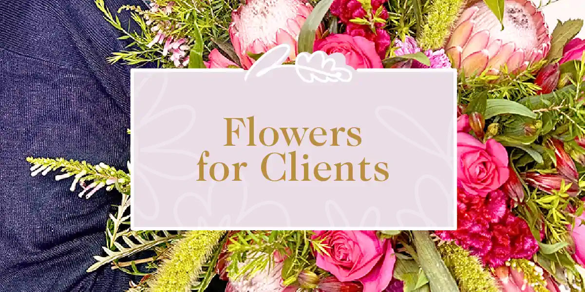 A vibrant flower bouquet featuring pink roses and proteas, ideal for gifting to clients. Fabulous Flowers and Gifts - Flowers for Clients