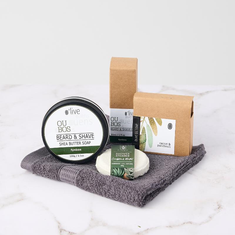 For Him Pamper Box featuring beard and shave soap, shower steamer, and olive oil soap for a relaxing self-care experience.