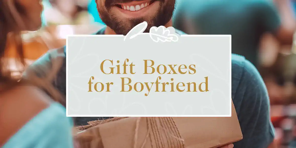 A cheerful man receiving a thoughtfully curated gift box from his partner. Fabulous Flowers and Gifts - Gift Boxes for Boyfriend