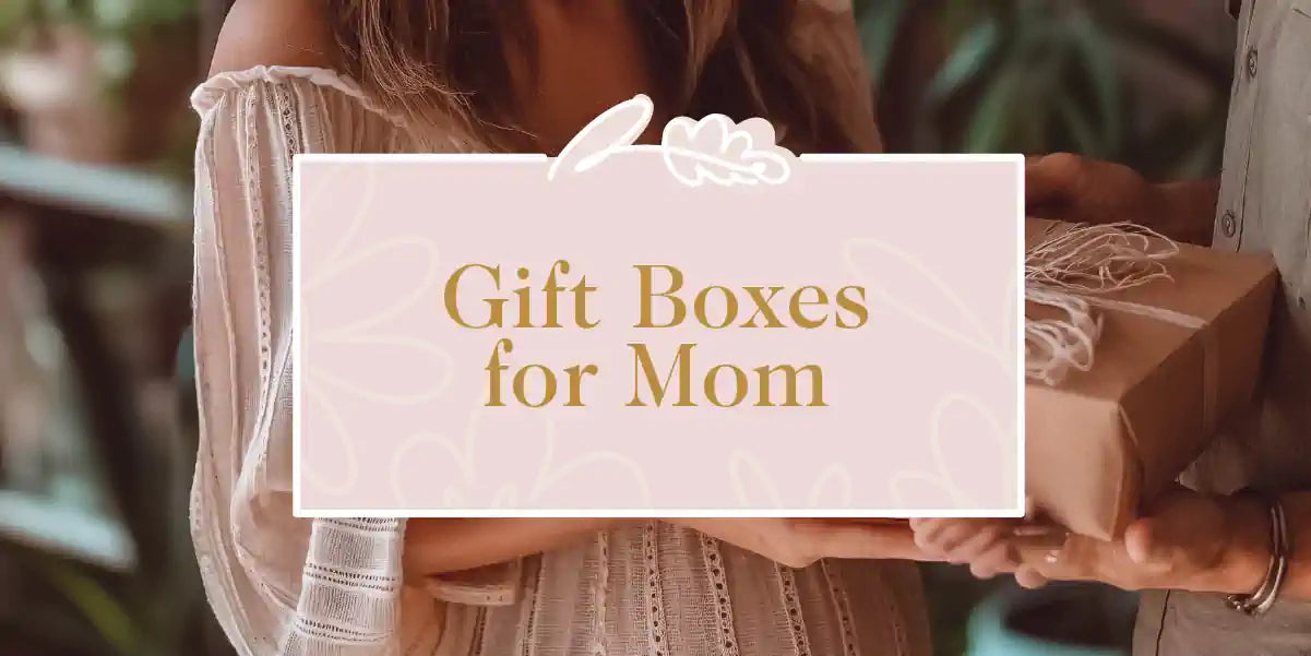 A mother receiving a gift box from her daughter, perfect for showing appreciation and love. Fabulous Flowers and Gifts - Gift Boxes for Mom