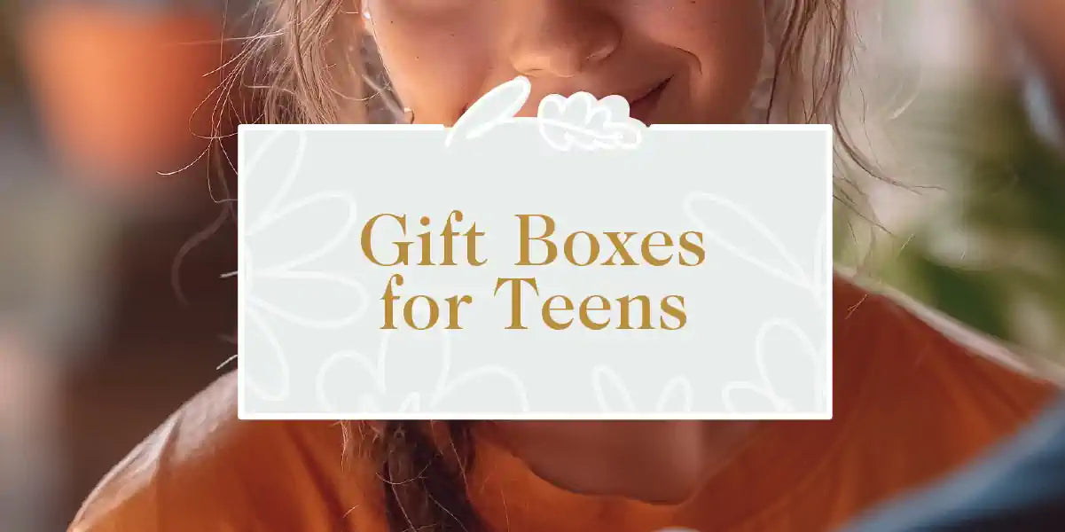 A teenager happily unwrapping a stylish gift box in a brightly lit room with vibrant flowers around. Fabulous Flowers and Gifts - Gift Boxes for Teens