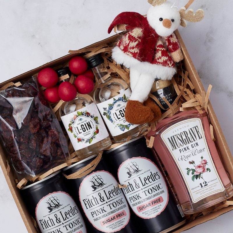 Gin-gle All the Way Gift Box with craft gins, pink tonic waters, chocolate truffles, and festive reindeer plush.