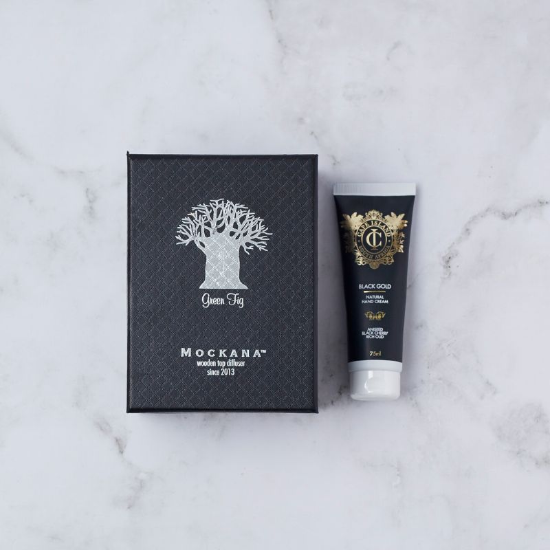 Mockana green fig diffuser in box with Cape Island Black Gold hand cream for a luxurious aromatic experience.