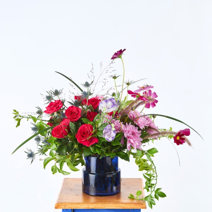 Gucci Grande Flower Arrangement with Roses and Cosmos in a Dark Blue Vase.