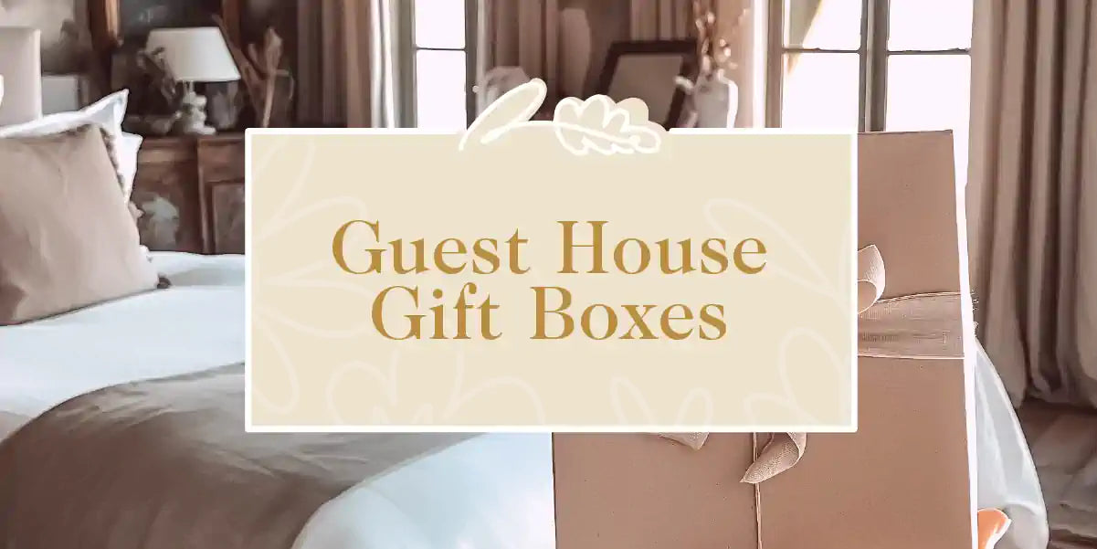 A beautifully wrapped gift box placed in a luxurious guest house setting, highlighting hospitality. Fabulous Flowers and Gifts - Guest House Gift Boxes