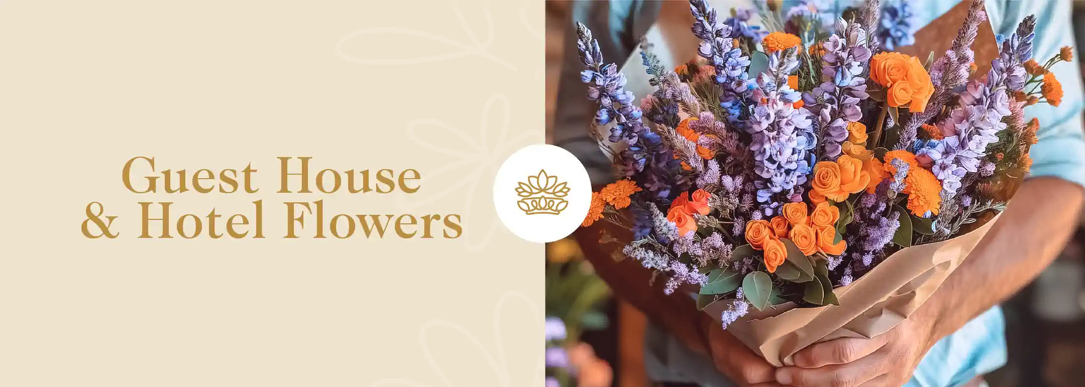 A person holding a lush bouquet of vibrant orange roses and blue flowers, tailored for enhancing hotel and guest house environments. Part of the Hotel and Guest House Flowers Collection from Fabulous Flowers and Gifts.