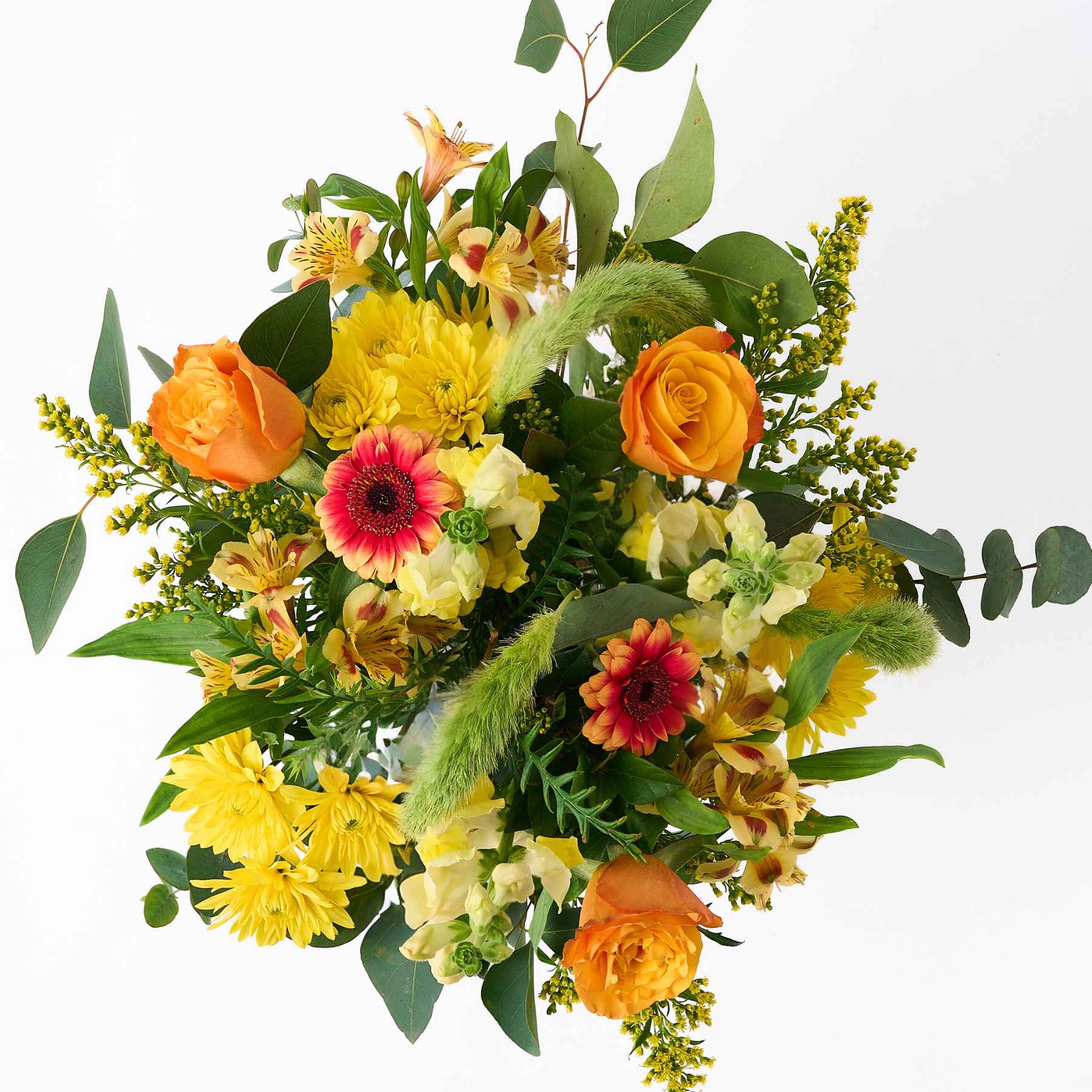 Top view of the 'Happiness in a Jar' flower arrangement, showcasing a lively mix of yellow, orange, and pink flowers, beautifully arranged in a glass jar