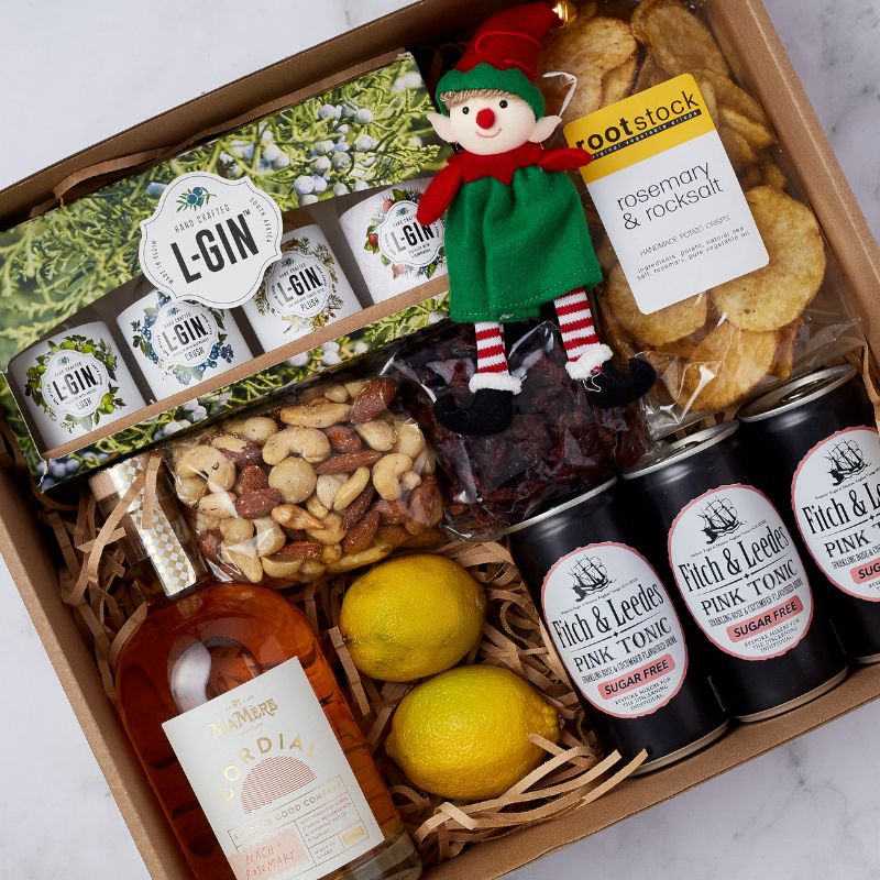 Holiday Spirits Gin Gift Box featuring L-Gin handcrafted gin, Fitch & Leedes Pink Tonic, gourmet snacks, and a festive elf decoration.