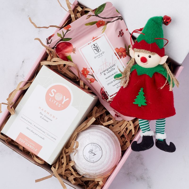 Joyful Noel Pamper Gift Box with pomegranate & vanilla bath soak, soy candle, bath bomb, and festive elf plush