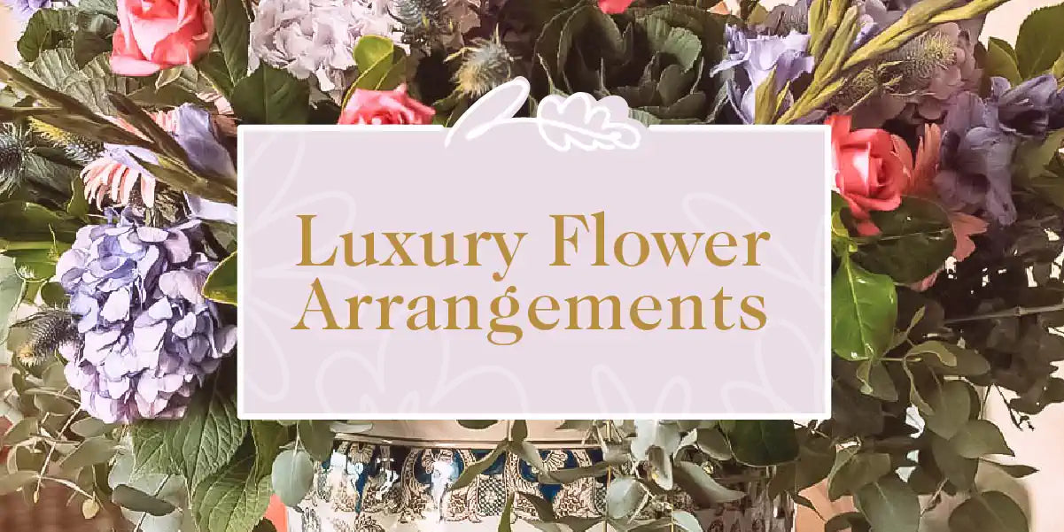 Luxury Flower Arrangements: Beautiful Floral Display with Pink Roses, Purple Hydrangeas, and Lush Greenery in an Elegant Vase. Perfect for Upscale Decor. Fabulous Flowers and Gifts.