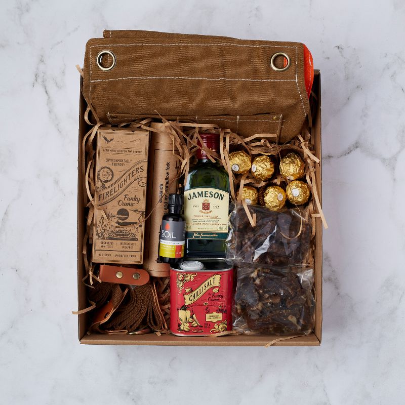 Outdoor Adventure gift box with whiskey, biltong, chili salt, and firelighters in eco-friendly packaging