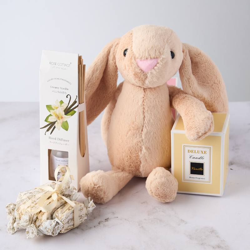 Plush bunny gift set featuring a soft toy, vanilla reed diffuser, and candle - perfect for a cosy, comforting experience.