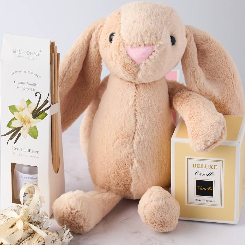 Soft plush bunny gift set with creamy vanilla diffuser and candle, ideal for a sweet and soothing gift experience.