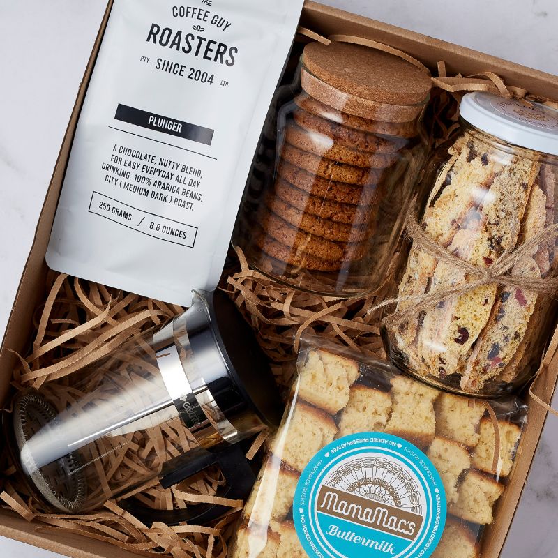 Gift box with coffee plunger, roasted coffee beans, cookies, biscotti, and buttermilk rusks