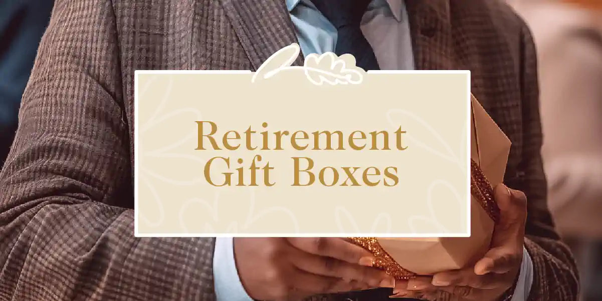 A person in a suit holding an elegantly wrapped gift box, perfect for a retirement celebration. Fabulous Flowers and Gifts - Retirement Gift Boxes