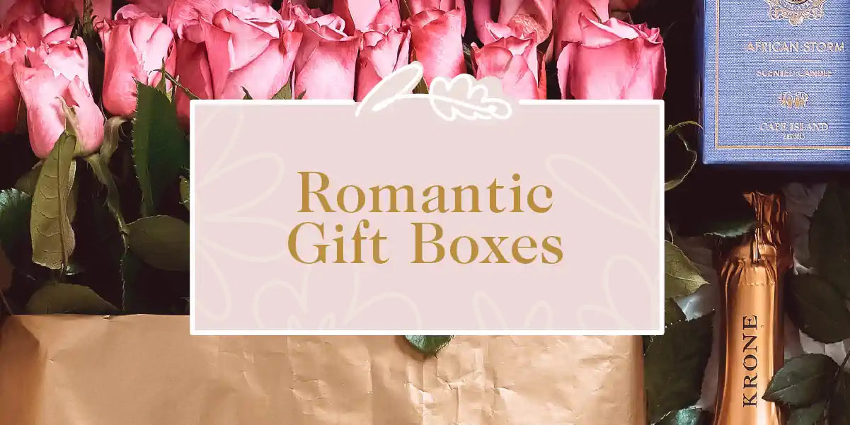 A beautifully arranged romantic gift box, featuring roses and other thoughtful items. Fabulous Flowers and Gifts - Romantic Gift Boxes