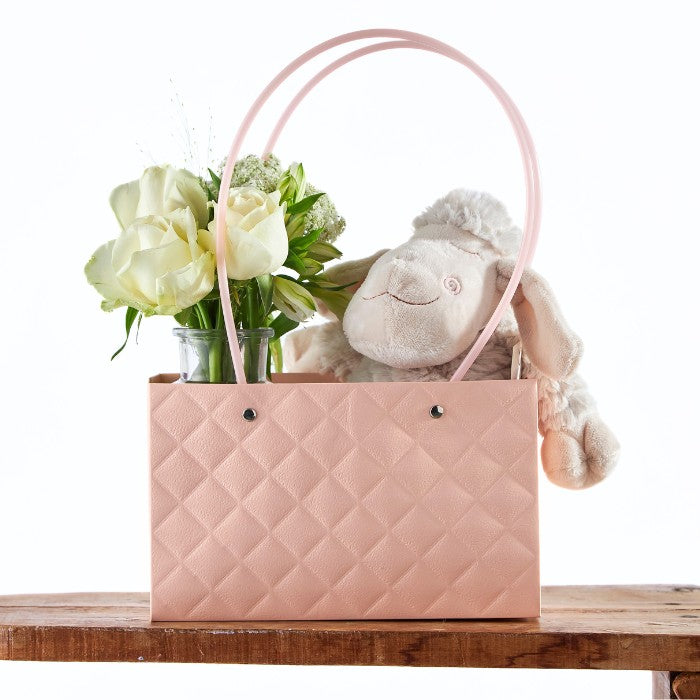 Close-up of the Rosy Lamb Gift Tote with a soft plush lamb and elegant floral arrangement in a stylish pink tote, ideal for a delicate and decorative gift.