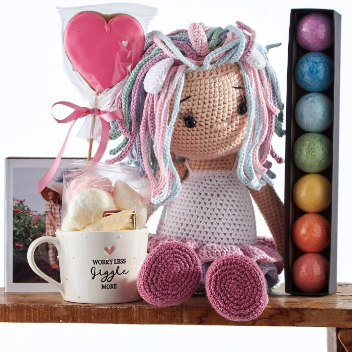 Sparkle & Shine Sweetheart Set with an adorable handmade doll, a mug filled with sweet treats, and decorative pastel-coloured balls, perfect for a special children's gift.