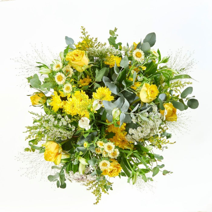 Elegant Sundance Bloom Box packed with yellow blooms and lush greenery, perfect for brightening any occasion.