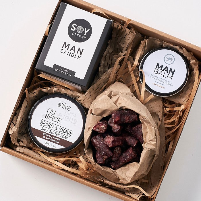 Top view of The Essentials Gift Box For Men, neatly packed with grooming products and snacks, ideal for masculine care and enjoyment.