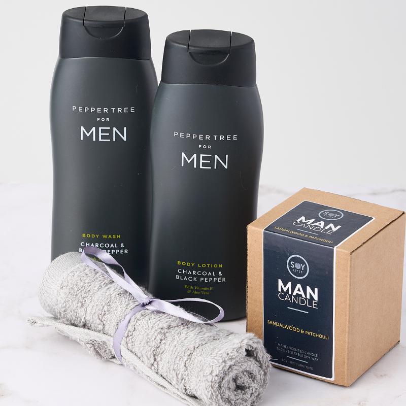 The Gentlemen's Retreat set with Peppertree body wash and lotion, plus a sandalwood & patchouli candle for ultimate relaxation.