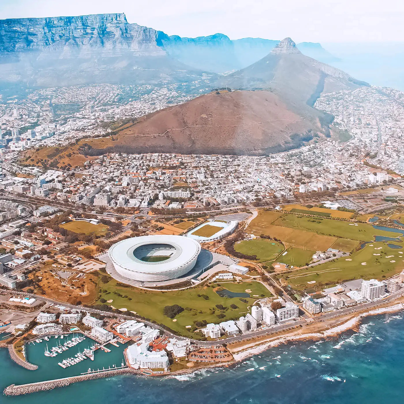 Aerial view of Cape Town featuring the stadium, Lion's Head, and Table Mountain. Fabulous Flowers and Gifts. Cape Town.